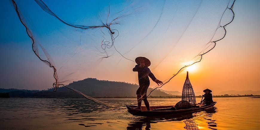Fischer im Mekong in Vietnam