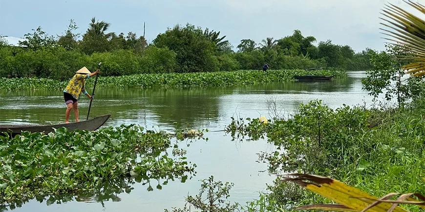 Vietnamese person on a boat in the Mekong Delta